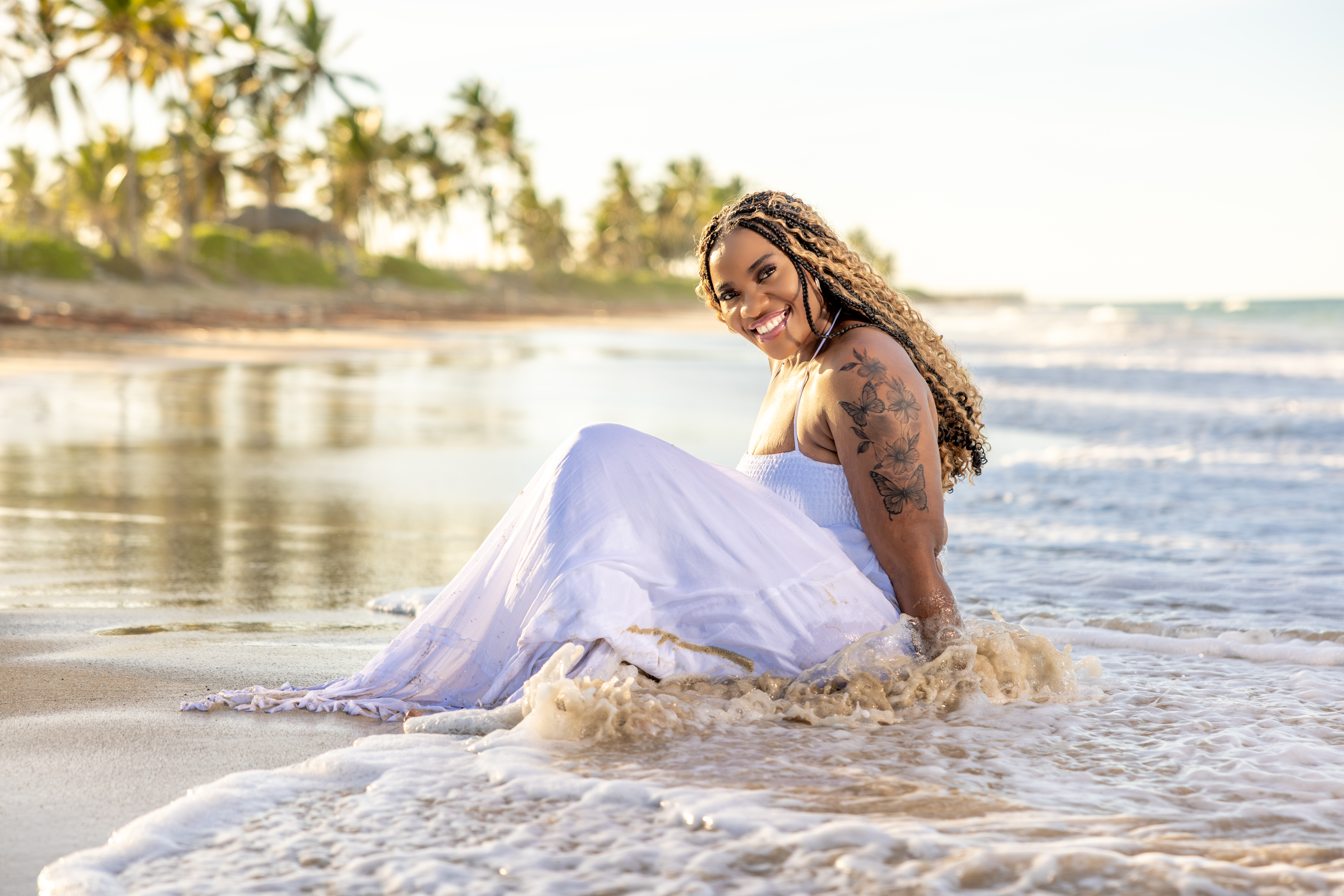 Beach Portrait in Caribbean Golden Light Woman beach portrait Santo Domingo white flowing dress in golden sunset water, professional photographer